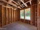 Unfinished bedroom space exhibiting two windows for natural light in new home construction at 209 Atkins Rd, Cameron, NC 28326