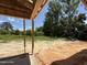 Unfinished back porch with exposed framing offering views of a green landscape at 235 Atkins Rd, Cameron, NC 28326