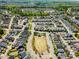 An aerial view of a well-planned neighborhood showcasing many single Gathering homes with mature trees and landscaping at 241 Serenity Hill Circle Cir, Chapel Hill, NC 27516
