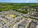 An elevated view of a residential neighborhood with a mix of single Gathering homes surrounded by green trees and lawns at 241 Serenity Hill Circle Cir, Chapel Hill, NC 27516