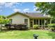 Charming backyard featuring lush greenery, well-maintained lawn, and enclosed porch at 241 Serenity Hill Circle Cir, Chapel Hill, NC 27516