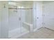 Bathroom showcasing a glass-enclosed shower with white tile, built-in bench, and recessed lighting at 241 Serenity Hill Circle Cir, Chapel Hill, NC 27516