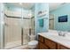 Stylish bathroom featuring a glass shower, vanity with mirror, and serene blue accents at 241 Serenity Hill Circle Cir, Chapel Hill, NC 27516