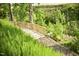 Wooden community bridge surrounded by lush greenery and natural landscape at 241 Serenity Hill Circle Cir, Chapel Hill, NC 27516