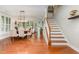 Elegant dining room with hardwood floors, staircase, and views into living spaces at 241 Serenity Hill Circle Cir, Chapel Hill, NC 27516
