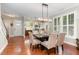 Open-concept dining area with stylish lighting and views to the kitchen and living spaces at 241 Serenity Hill Circle Cir, Chapel Hill, NC 27516
