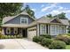 Charming home featuring a two-car garage, well-maintained landscaping, and inviting curb appeal at 241 Serenity Hill Circle Cir, Chapel Hill, NC 27516