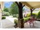 Inviting front porch with stone pillar bases, comfortable seating and picturesque neighborhood view at 241 Serenity Hill Circle Cir, Chapel Hill, NC 27516
