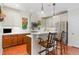 Well-lit kitchen featuring updated cabinets, stainless steel appliances, and a cozy breakfast bar at 241 Serenity Hill Circle Cir, Chapel Hill, NC 27516