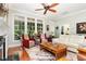 Bright and airy living room with large windows, hardwood floors, and comfortable seating at 241 Serenity Hill Circle Cir, Chapel Hill, NC 27516
