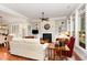 Open living area featuring a fireplace, built-ins, and seamless flow to the dining and kitchen areas at 241 Serenity Hill Circle Cir, Chapel Hill, NC 27516