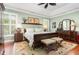 Spacious main bedroom with tray ceiling, decorative rug, and lots of natural light at 241 Serenity Hill Circle Cir, Chapel Hill, NC 27516