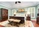 Cozy main bedroom with decorative rug, two bedside tables, and lots of natural light at 241 Serenity Hill Circle Cir, Chapel Hill, NC 27516
