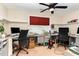 Spacious office with multiple work areas, built-in shelving, and ceiling fan at 241 Serenity Hill Circle Cir, Chapel Hill, NC 27516