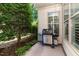 Outdoor patio featuring a grill and lush landscaping at 241 Serenity Hill Circle Cir, Chapel Hill, NC 27516