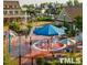 Briar Chapel community splash pad featuring colorful umbrellas and seating areas at 241 Serenity Hill Circle Cir, Chapel Hill, NC 27516