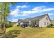 Exterior of home features a well-manicured lawn with mulch beds along the foundation and a spacious backyard at 2634 Yellow Pine Rd, Raleigh, NC 27616