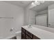 Another bathroom with dark wood cabinets and a shower at 2634 Yellow Pine Rd, Raleigh, NC 27616
