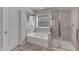 Bathroom with a soaking tub and separate shower, providing a relaxing retreat at 2634 Yellow Pine Rd, Raleigh, NC 27616