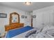 Bright bedroom with an antique vanity, ensuite, and plush bedding at 2634 Yellow Pine Rd, Raleigh, NC 27616