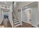 Hallway with stairs leading to upper level, showcasing modern design and easy access to rooms at 2634 Yellow Pine Rd, Raleigh, NC 27616