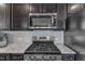 Close-up of a gourmet kitchen featuring stainless steel appliances and granite countertops at 2634 Yellow Pine Rd, Raleigh, NC 27616