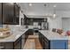 Bright kitchen with dark cabinetry, granite countertops, stainless appliances and island seating at 2634 Yellow Pine Rd, Raleigh, NC 27616