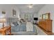 Spacious main bedroom featuring a large bed, dresser, and a well-lit sitting area at 2634 Yellow Pine Rd, Raleigh, NC 27616