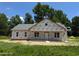 Exterior of a new construction home showcasing the facade and covered entrance, surrounded by a green lawn at 275 Atkins Rd, Cameron, NC 28326
