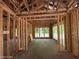 The interior wood framing of a house with window views of the outdoors at 275 Atkins Rd, Cameron, NC 28326