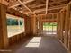 Interior framing of room showcasing window and door placements, with wooden beams and flooring at 275 Atkins Rd, Cameron, NC 28326