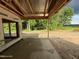 Patio with wooden framing and concrete floor, with an exterior view of the surrounding land at 275 Atkins Rd, Cameron, NC 28326