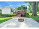 Spacious backyard with deck, fire pit, and lush greenery, perfect for outdoor gatherings at 2925 Redwood Rd, Durham, NC 27704