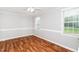 Light and airy bedroom with hardwood floors and neutral wall color at 2925 Redwood Rd, Durham, NC 27704