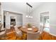 Staged dining room featuring a round table and chairs under a pendant light at 2925 Redwood Rd, Durham, NC 27704