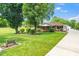 Charming single-story home with a well-manicured lawn, mature trees, and a welcoming front porch at 2925 Redwood Rd, Durham, NC 27704