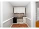 Stylish hallway with white cabinets, wine storage, and decorative backsplash at 2925 Redwood Rd, Durham, NC 27704
