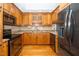 Traditional kitchen featuring warm wood cabinetry, granite countertops and stainless steel appliances at 2925 Redwood Rd, Durham, NC 27704