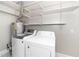 Functional laundry room with washer, dryer, and storage shelves at 2925 Redwood Rd, Durham, NC 27704