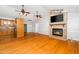 Spacious living area with a fireplace, hardwood floors, and an open layout leading to the kitchen at 2925 Redwood Rd, Durham, NC 27704
