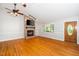 Bright and airy living room with hardwood floors, fireplace, and a front door with glass insets at 2925 Redwood Rd, Durham, NC 27704