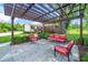 Relaxing outdoor patio under a pergola with comfortable seating and manicured landscaping at 2925 Redwood Rd, Durham, NC 27704