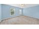 Bright bedroom with dual windows, carpeted floors, and light blue walls at 308 Minton Valley Ln, Cary, NC 27519