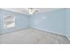 Neutral colored bedroom with a ceiling fan, window and carpeted floors, with light blue walls at 308 Minton Valley Ln, Cary, NC 27519
