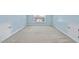 Spacious bonus room with attic access, carpeted floors and natural lighting from the window at 308 Minton Valley Ln, Cary, NC 27519