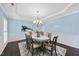 Elegant dining room with modern chandelier and classic wainscoting, great for entertaining guests at 308 Minton Valley Ln, Cary, NC 27519