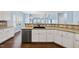Bright and modern kitchen with sleek stainless steel dishwasher and ample counter space at 308 Minton Valley Ln, Cary, NC 27519