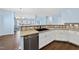 Stylish kitchen with a stainless steel dishwasher, quartz countertop, and a double basin sink at 308 Minton Valley Ln, Cary, NC 27519