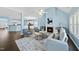 Spacious living room is open to the kitchen and dining area with light blue walls at 308 Minton Valley Ln, Cary, NC 27519