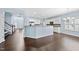 Open-concept living area featuring hardwood floors and light-filled rooms at 308 Minton Valley Ln, Cary, NC 27519